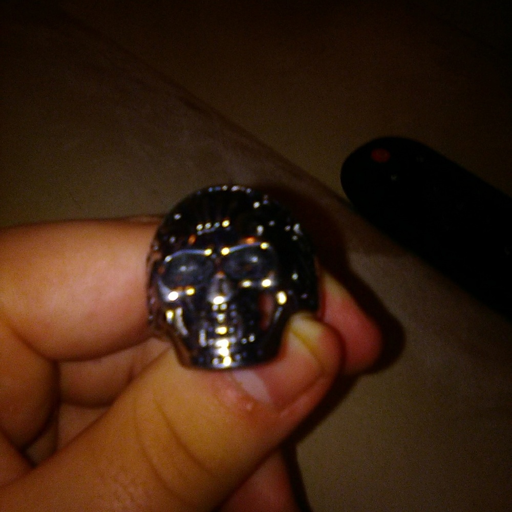 A stainless steel watch and ring